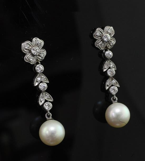 A pair of mid 20th century white metal, cultured pearl and diamond set drop earrings, 1.5in.